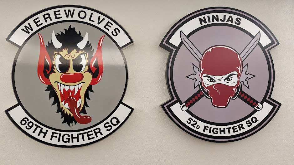 69th and 52nd Fighter Squadron emblems.